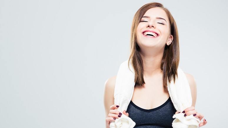 Girl laughing with towel