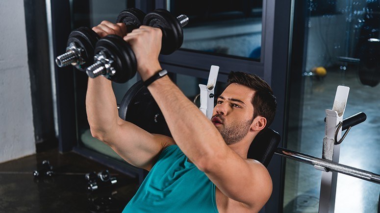 man with dumbbells