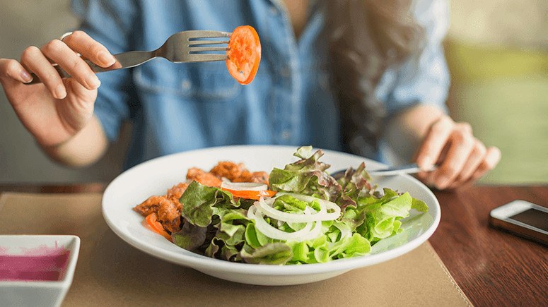 woman eating a salad